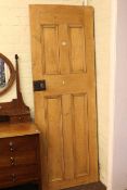 Stripped pine panelled door, 201cm by 71cm.