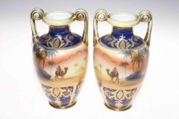 Pair Noritake desert scene two handle vases, 24.5cm.