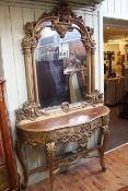 Gilt and floral swag painted serpentine front console table and mirror, 236cm high by 142cm wide.
