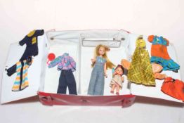 Pippa doll with baby and clothing in original case.