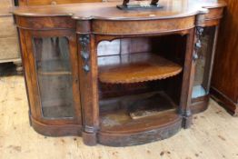 Victorian mahogany shaped front credenza having open centre flanked by two shaped glazed panel