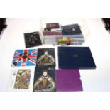 Collection of coin presentation packs, cased commemorative crowns.