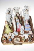 Tray lot with various figurines including small Hummel, cherub candlesticks, etc.