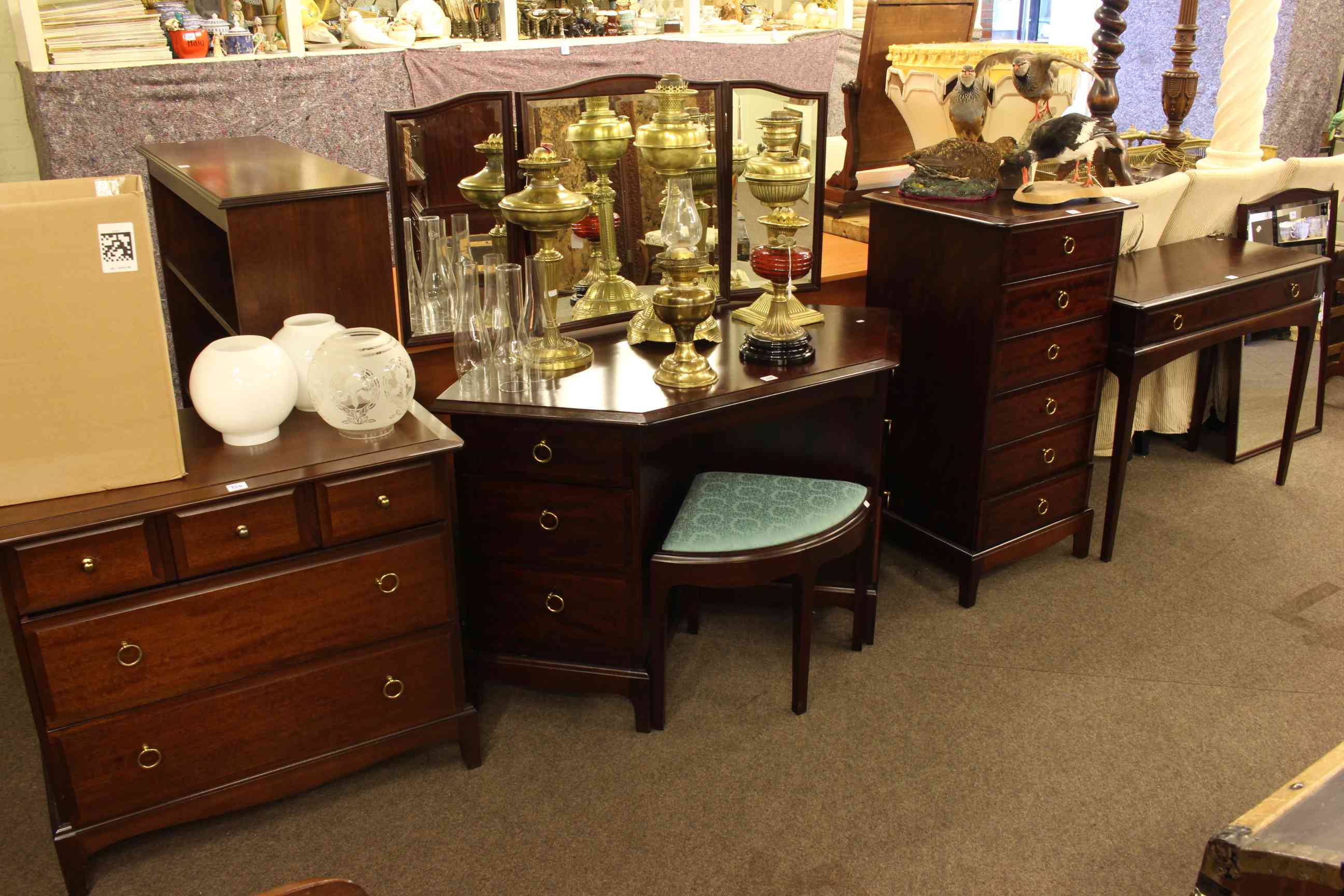 Collection of Stag Minstrel furniture to include corner dressing table and stool, five drawer chest,