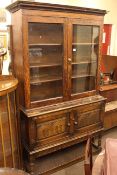 Oak glazed door bookcase top, carved oak two door side cabinet, campaign style bed frame,