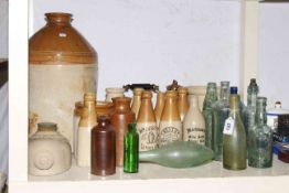 Collection of stoneware and glass vintage bottles and jars, miners lamp and copper kettle.