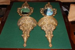 Pair gilt wall sconces and a pair of gilt mirrors.