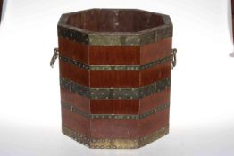 Octagonal mahogany and brass bound two handled coal bucket, 34cm high.