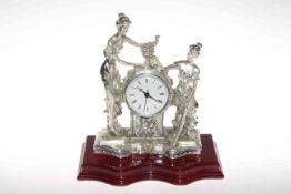 Ornate figure mantel clock with quartz movements, 29cm high.