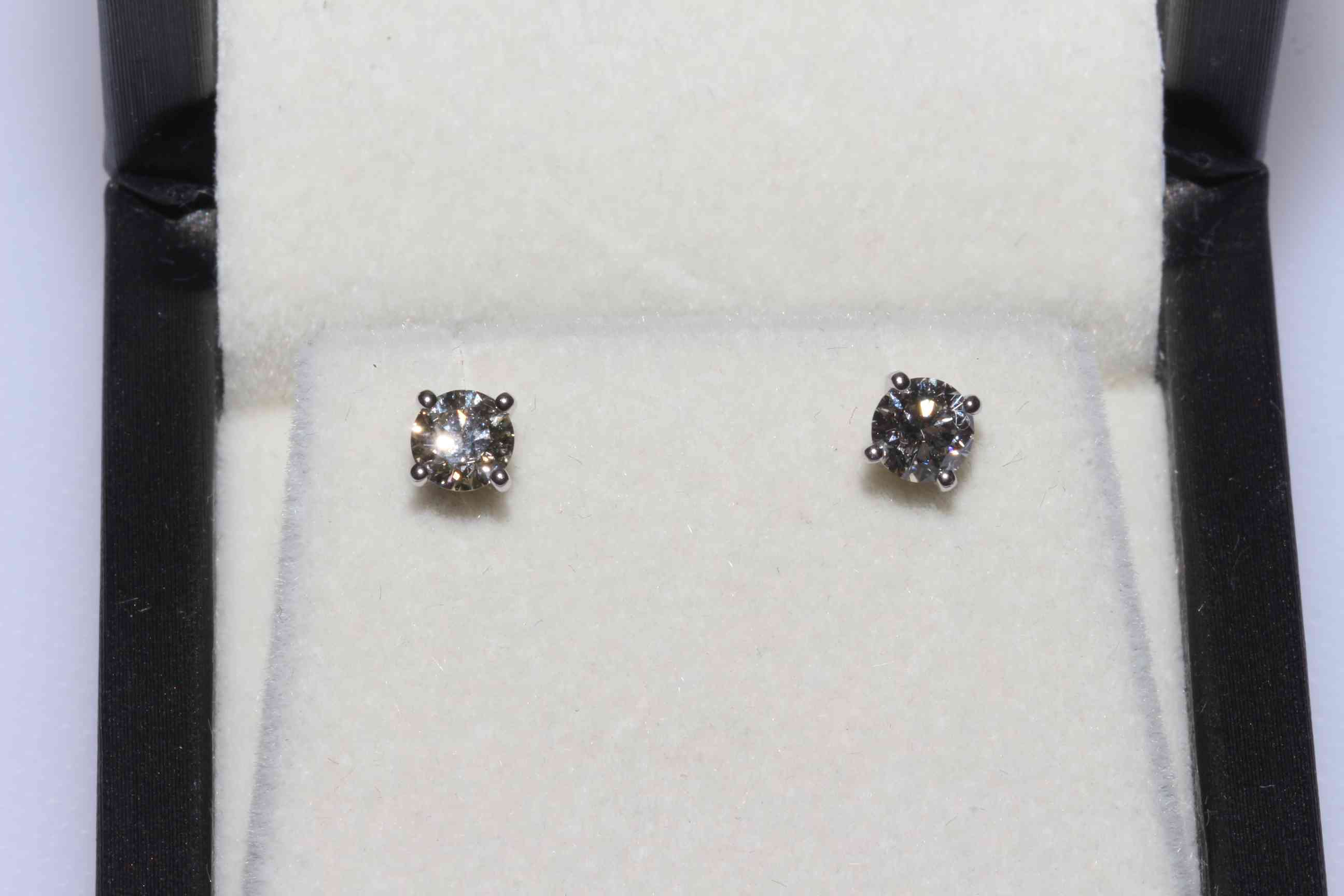 Diamond stud 18 carat white gold earrings, total approximate diamond weight 0.8 carat.