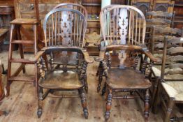 Four antique Windsor broadarm pierced splat back chairs.