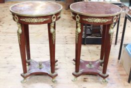 Pair Empire style walnut and brass mounted circular side/lamp tables, 90cm high by 60cm diameter.