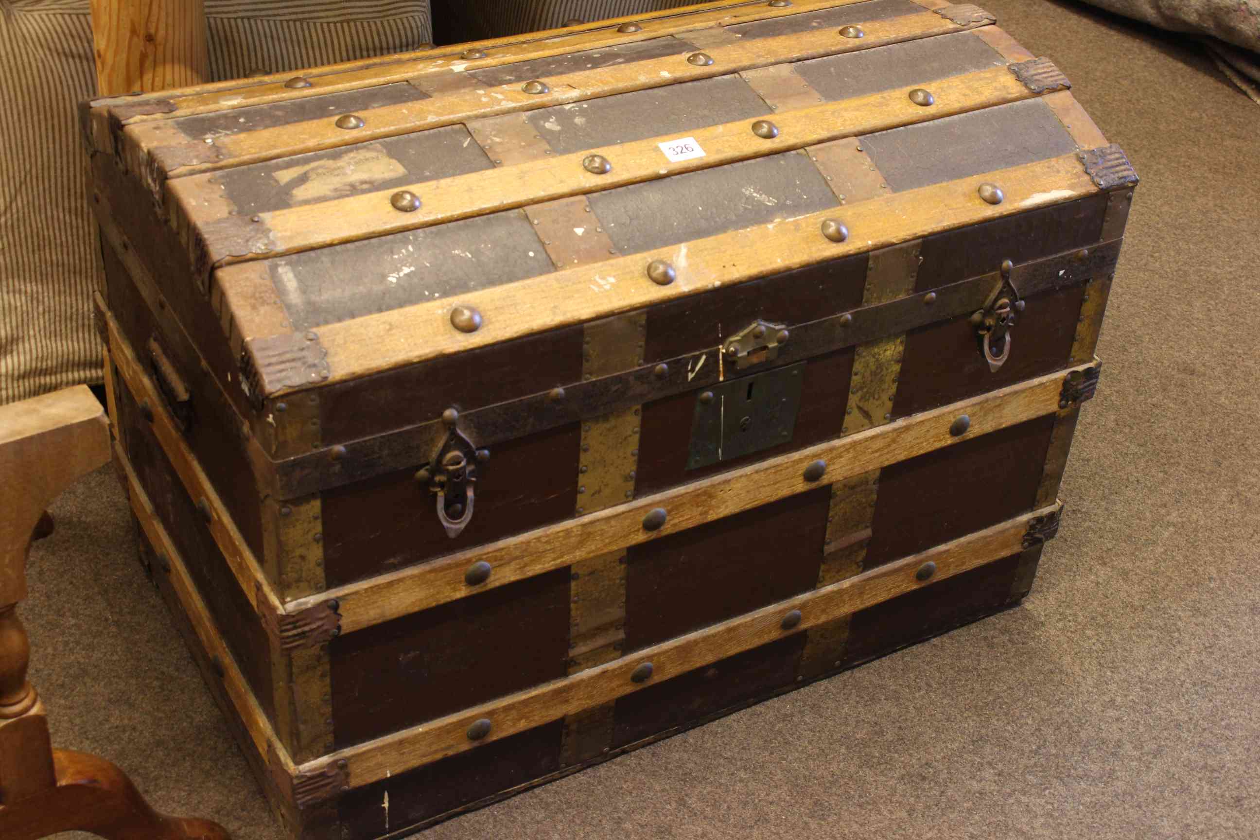 Vintage wood bound dome trunk, 54cm high by 76cm wide by 45cm deep.