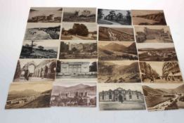 Collection of sepia topographical postcards.