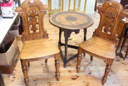 Carved oak cricket table dated 1919, 63cm high by 58cm diameter,