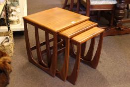 G. Plan nest of three teak tables (largest 52cm high by 48cm by 48cm).