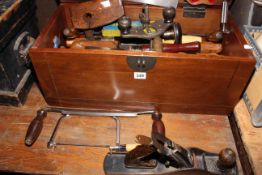 Tool box containing large wood chisels, saws, planes, etc (box 30cm by 59cm by 29cm).