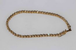 18 carat yellow gold and diamond tennis bracelet, approximate total diamond weight 2 carat.