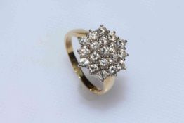 18 carat gold and diamond cluster ring having nineteen brilliant cut diamonds, size K/L.