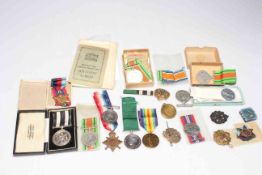 Collection of medals and military badges in: George V Royal Naval Volunteer Reserve Long Service