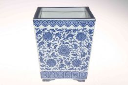 Chinese blue and white square planter of tapering form decorated with floral design, 25cm high.