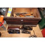 Tool box containing wood planes, sharpeners and other tools (box 30cm by 62cm by 28cm).