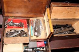 Two boxes containing spanners and engineering tools.