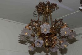 Pair of ornate leaf and flower design two tier twelve branch gilt metal centre ceiling lights with