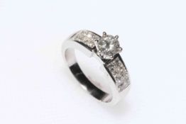 18 carat white gold diamond engagement ring having elevated 0.