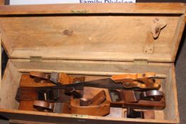 Tool box containing seven planes and saw (box 30cm by 85cm by 29cm).