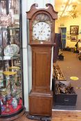 Antique oak eight day longcase clock having painted arched dial.