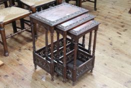 Carved hardwood and fretwork nest of three table (largest 62cm high by 51cm wide by 33cm deep).