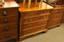 Siesta yew and mahogany chest of two short above three long drawers on bracket feet,