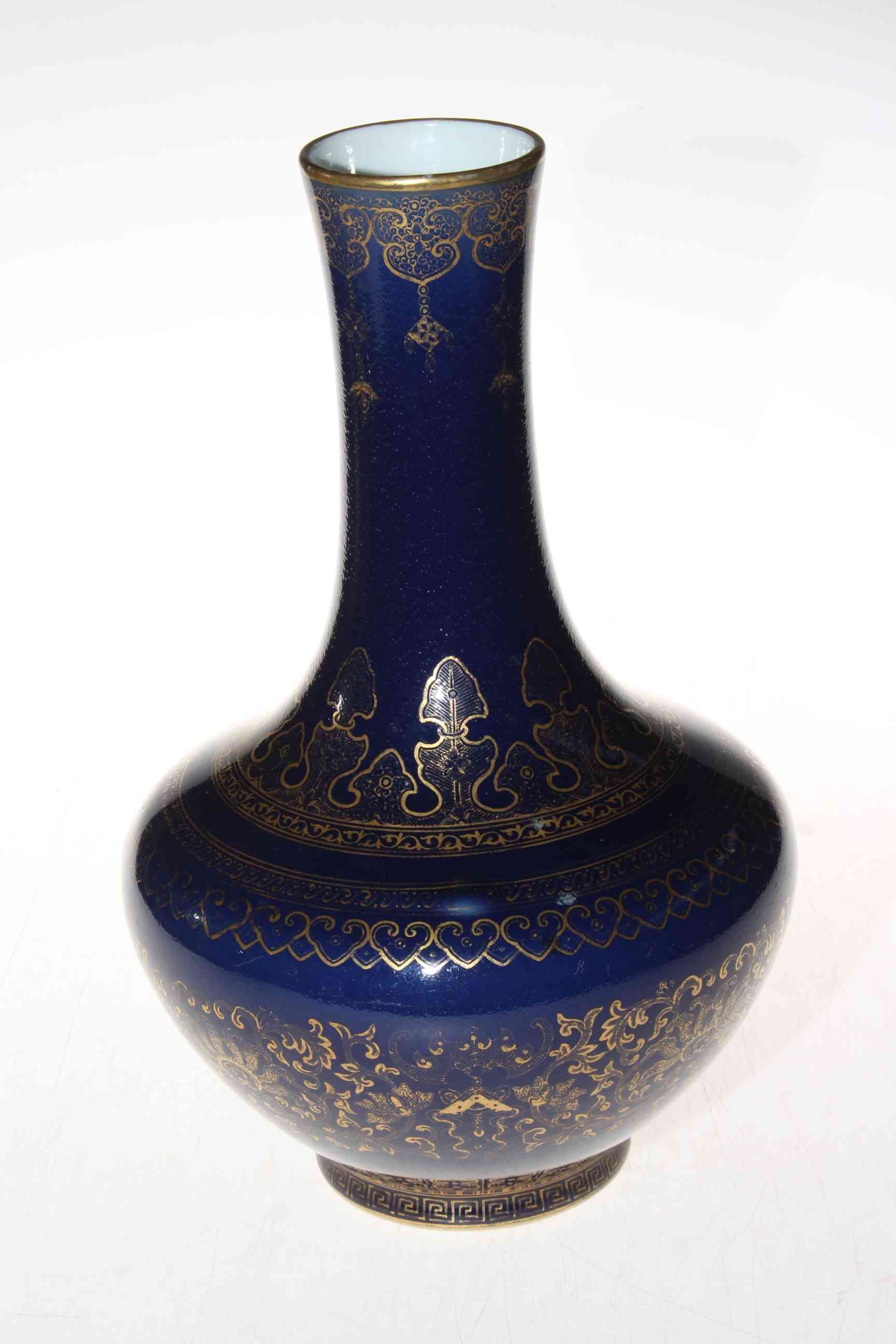Chinese gilt on blue decorated vase, blue mark to base, 29cm.