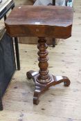 Victorian mahogany inverted serpentine front work table in turned pedestal triform base,