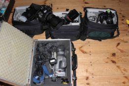 Collection of photography equipment including Fujifilm Finepix S9500, Nikon Coolpix 4500,