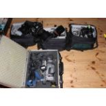 Collection of photography equipment including Fujifilm Finepix S9500, Nikon Coolpix 4500,