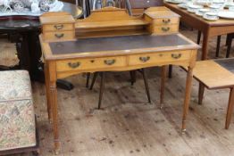 Late 19th/early 20th Century oak six drawer writing table on turned reeded legs,