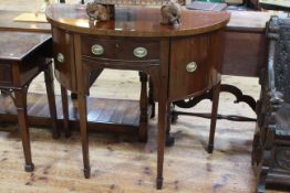 Early 19th Century mahogany bow front sideboard of neat proportions on tapering legs to spade feet,