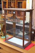Early 20th Century oak framed counter top display cabinet, 69cm high by 51cm wide by 32cm deep.