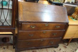 Georgian oak three drawer bureau, 105cm high by 107cm wide by 56cm deep.