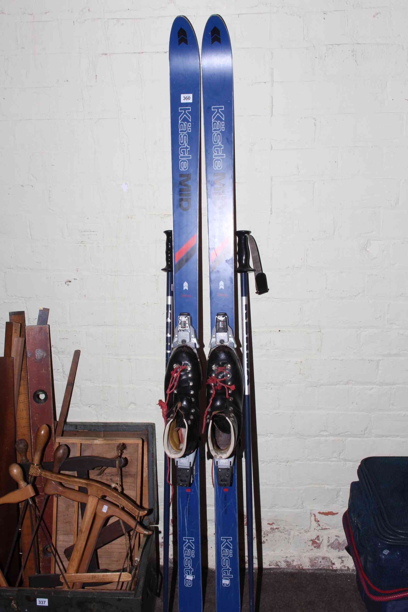 Pair Kastle mid snow ski's and poles.