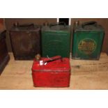 Four vintage petrol cans including Shell, Esso and Pratts.