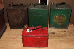 Four vintage petrol cans including Shell, Esso and Pratts.