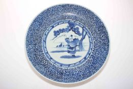 Large circular Chinese blue and white charger decorated with fisherman in landscape and symmetrical