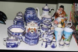 Collection of Ringtons including teapots and jars.