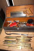 Tool box containing spirit levels, saw, etc (box 20cm by 56cm by 22cm).