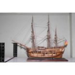 Carved wood galleon depicting HMS Endeavour, 85cm length.