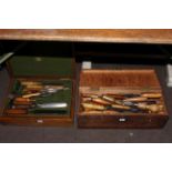 Two boxes containing large collection of wood chisels and tape measures.