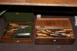 Two boxes containing large collection of wood chisels and tape measures.
